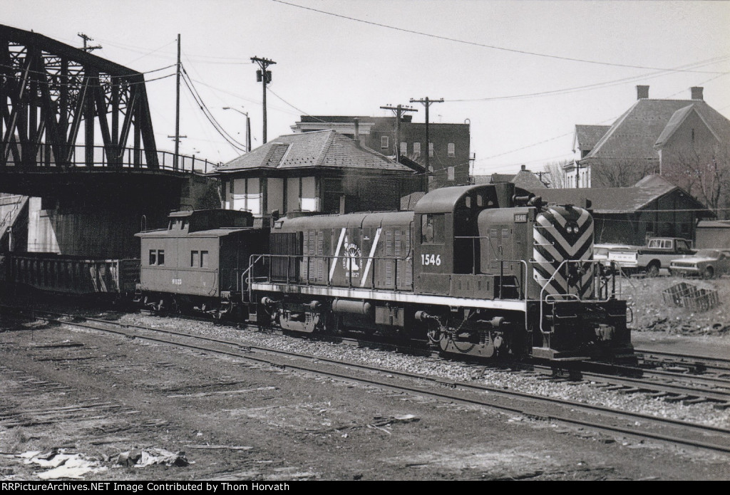 CNJ 1546 and trailing caboose start the workday of a new week